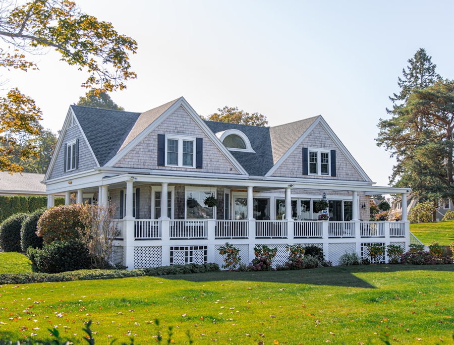 A classic white house with a wraparound porch